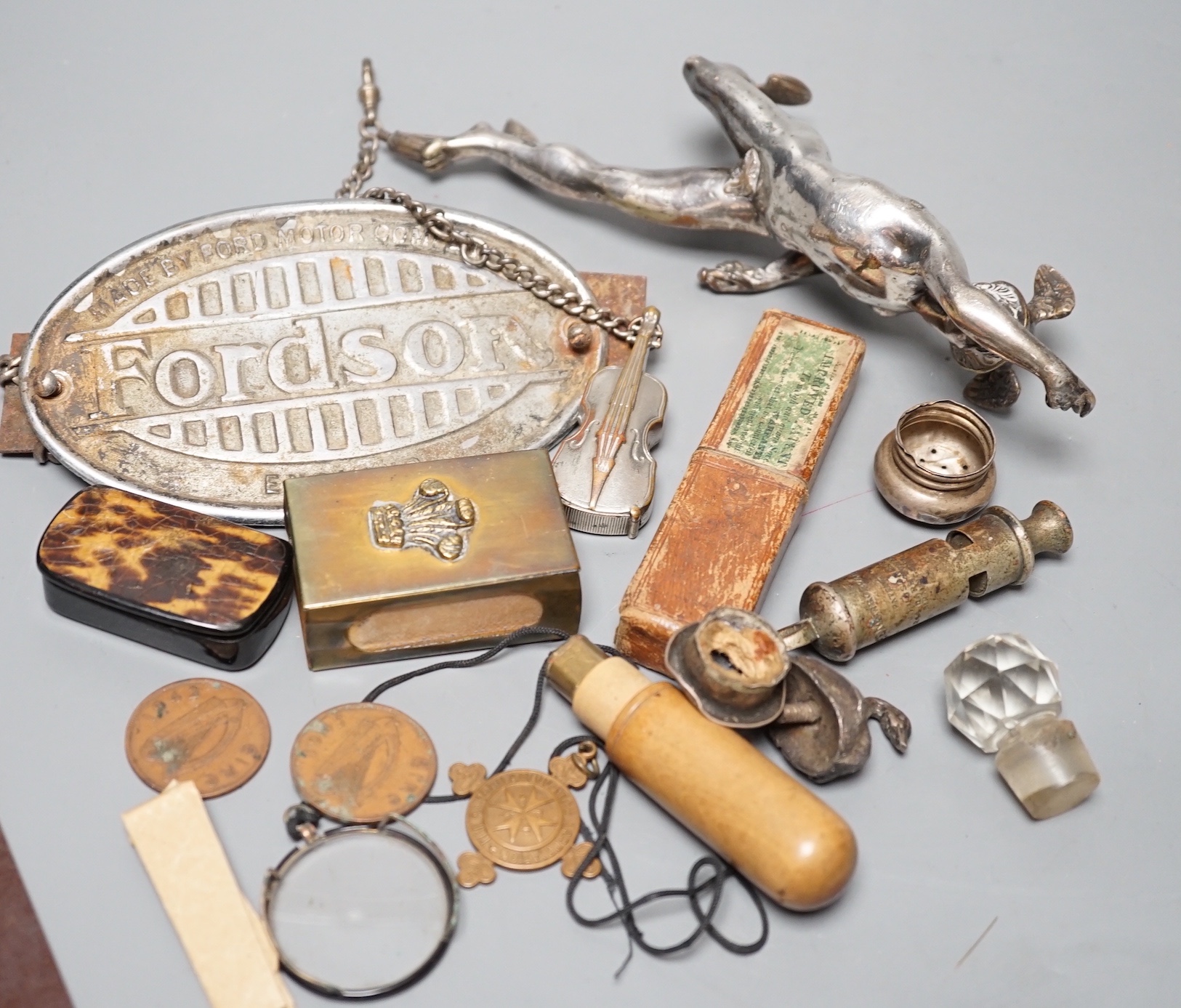 A collection of mixed collectables to include a plated Mercury car mascot, military badges and buttons, a plated double bass vesta on silver Albert, faux tortoishell snuff box etc.